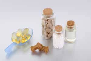 Various pet supplements and medications arranged on a light surface