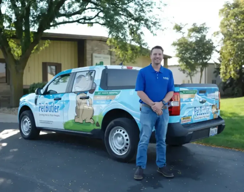 Pet Butler Franchise owner in front of Pet Butler truck