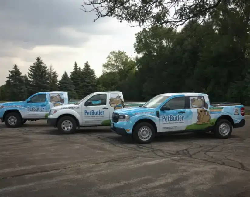 Images of three Pet Butler trucks